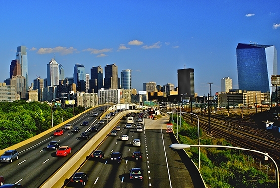 Philadelphia skyline in daytime with bright colors, showing Comcast Center (l) and Cira (r), BNY Mellon Center, Bell Atlantic Tower
