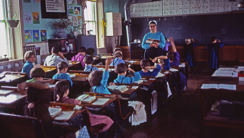 An Amish teacher leads a lesson in her one-room schoolhouse, Lancaster County, Pennsylvania. Photographing the Amish